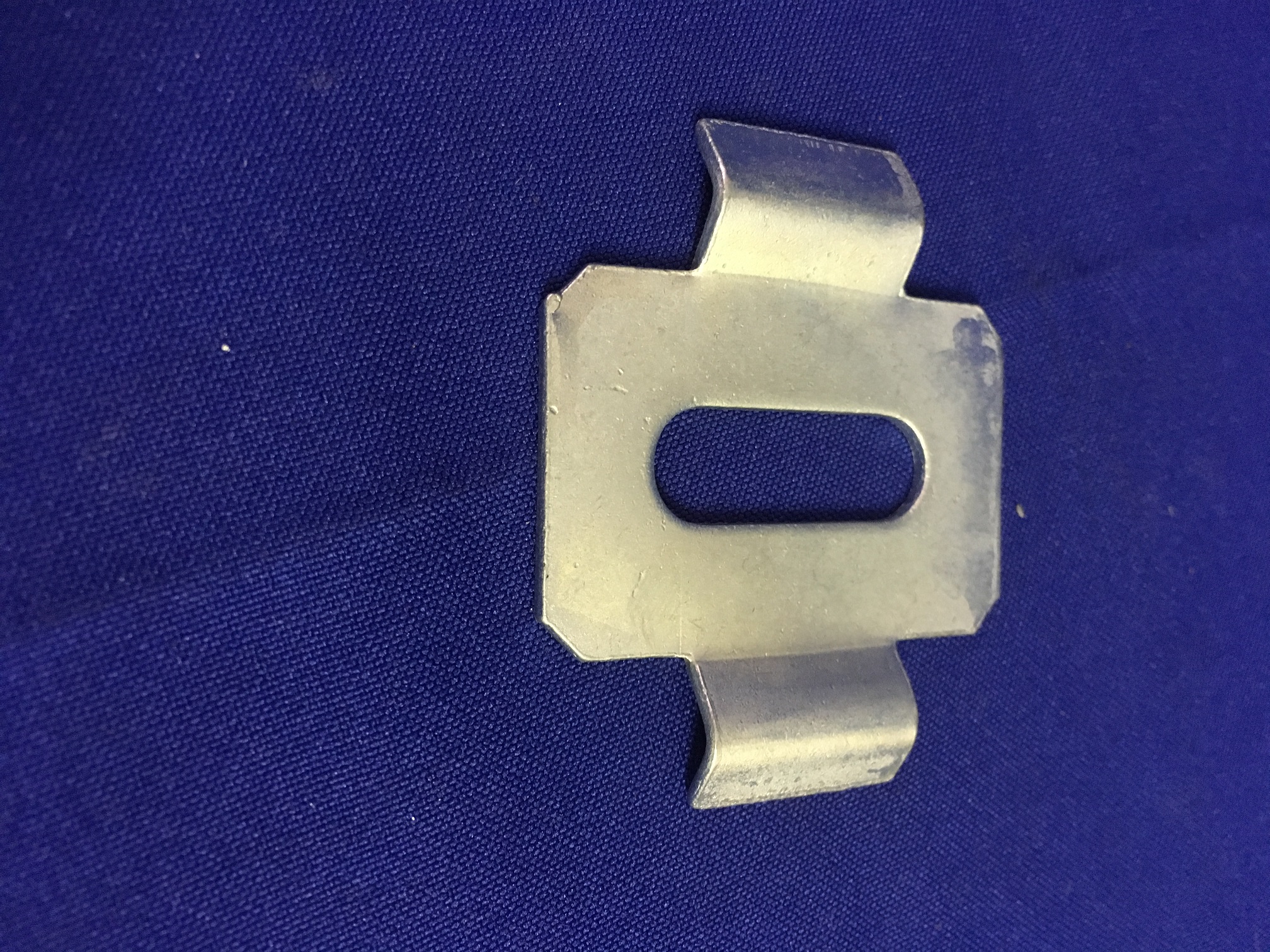 Slotted hold down saddle Slotted hold down saddle